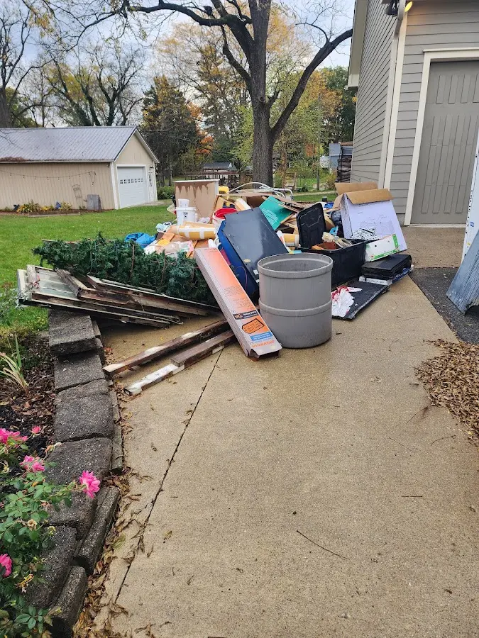 Dumpster being loaded with debris for Residential Dumpster Rental in Southampton